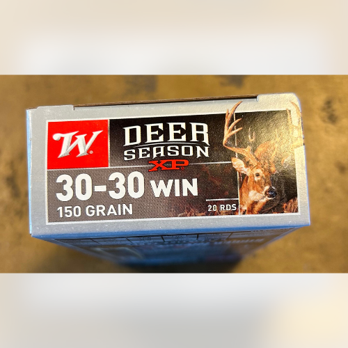 Box of deer hunting ammunition with a label reading 'Deer Season XP, 30-30 WIN, 150 Grain, 20 RDS.' Image of a deer with antlers.