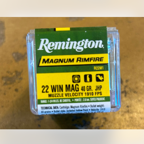 A green and yellow Remington ammunition box labeled 