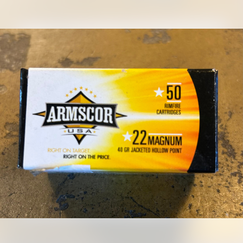 Box of Armscor .22 Magnum ammunition with a yellow and black design, showing 